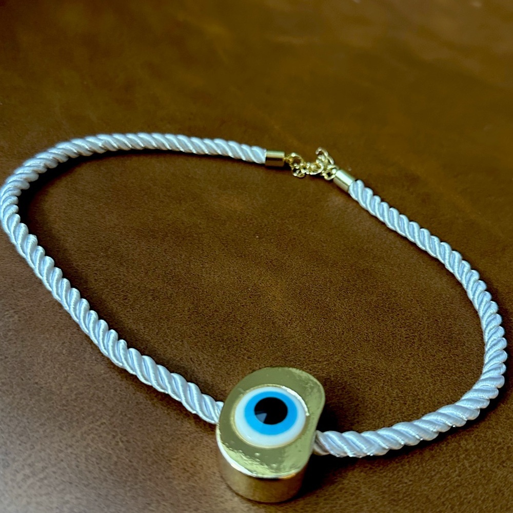 evil eye on gold pendant on white soft rope necklace - Picture 1 of 5